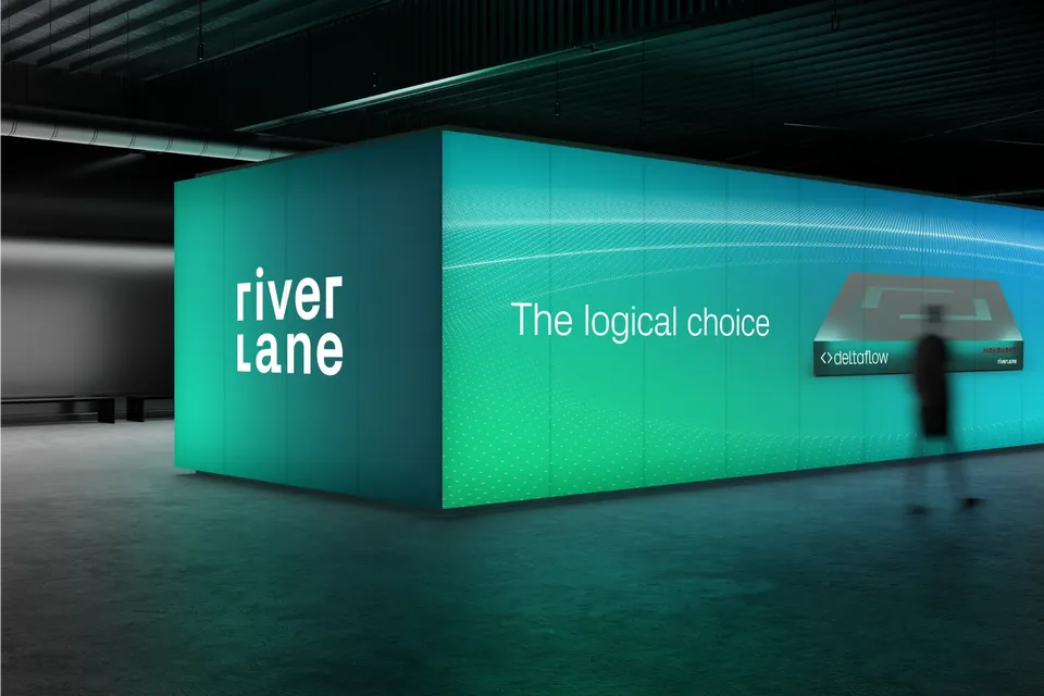 Large illuminated exhibition booth with Riverlane branding, the phrase ‘The logical choice,’ and a Deltaflow product display in a dark venue.