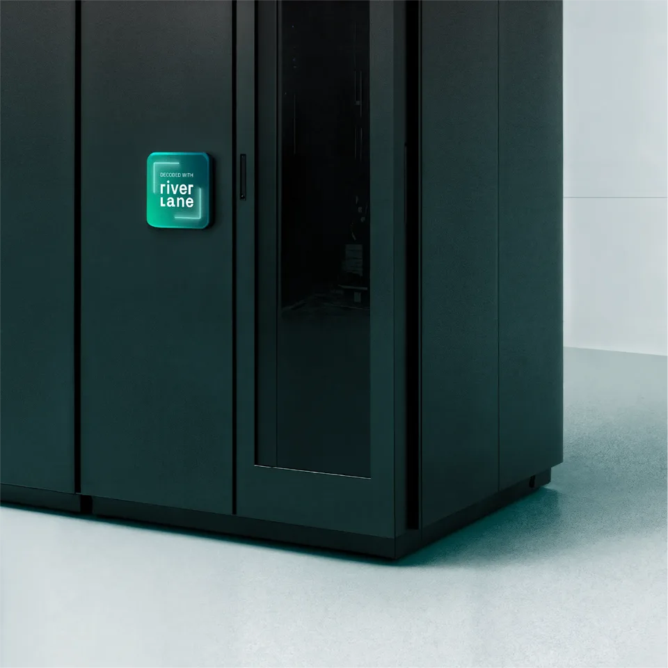 Black quantum computing server cabinet with a glowing badge reading ‘Decoded with Riverlane’