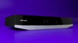 Image featuring the Tata Play console, shown on a purple background.